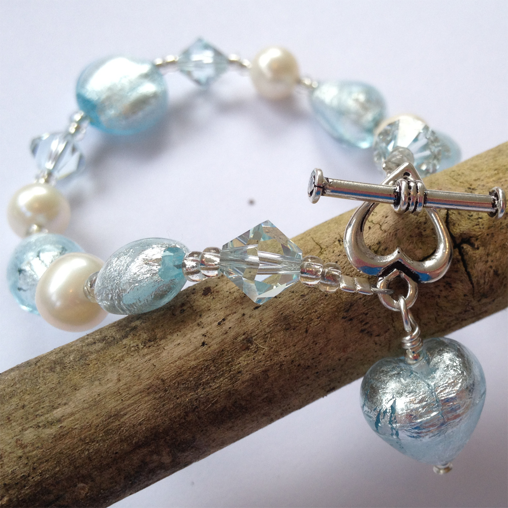 Bracelet with aquamarine (blue) Murano glass beads, Swarovski© crystals, pearls, charm