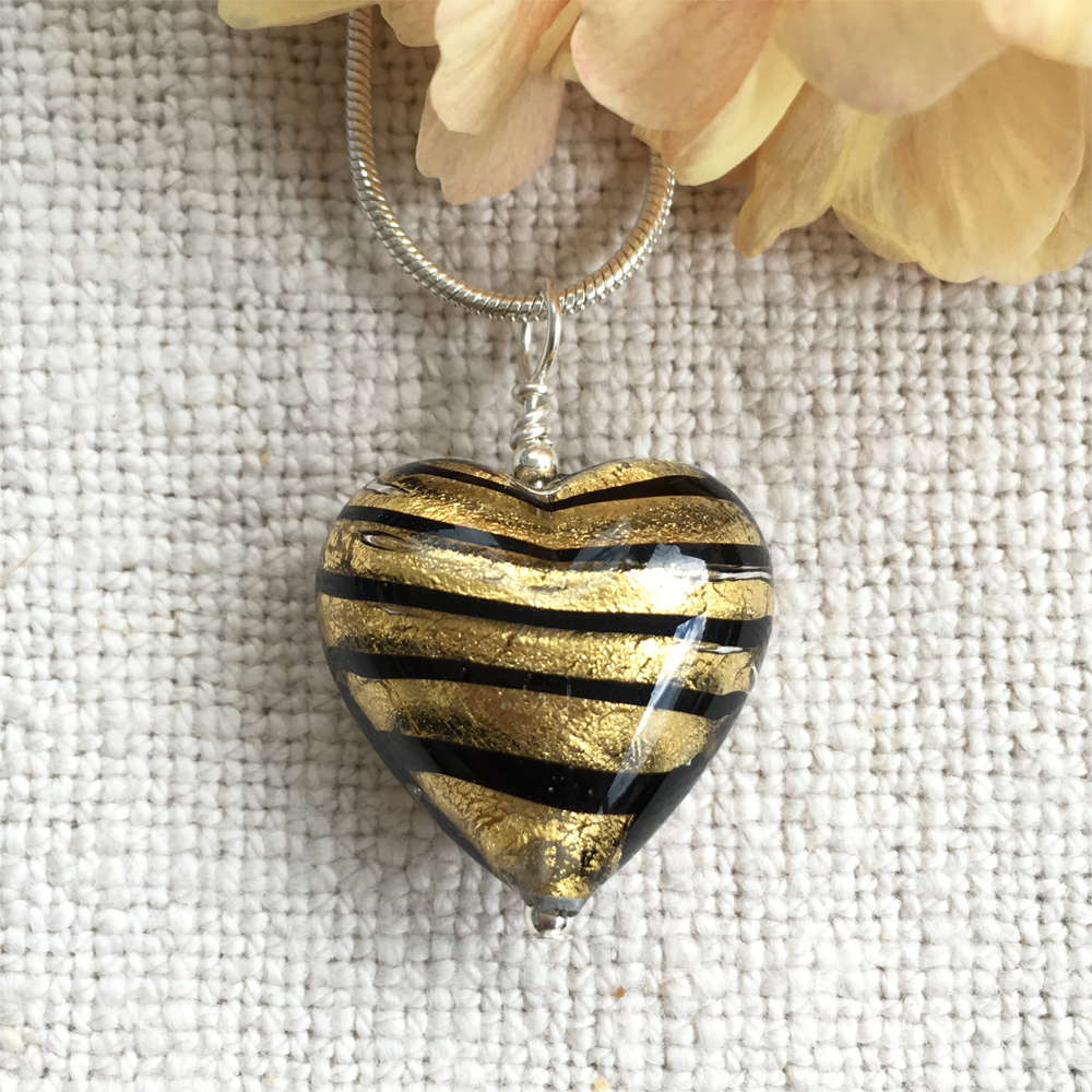 Necklace with black spiral and gold Murano glass medium heart pendant on silver chain