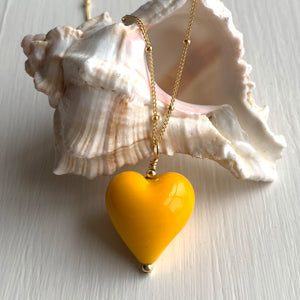 Necklace with dark yellow pastel Murano glass medium heart pendant on gold chain