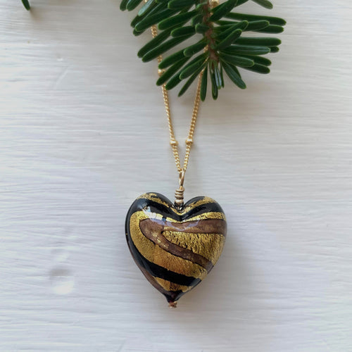 Necklace with black and aventurine swirl Murano glass medium heart pendant on gold chain