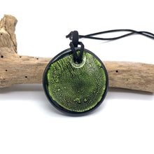 Necklace with light green and silver on black Murano glass near circular large flat pendant