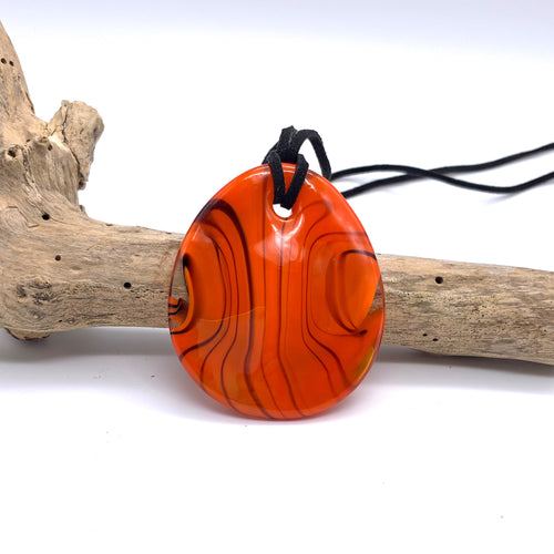 Necklace with orange pastel Murano glass near circular large flat pendant