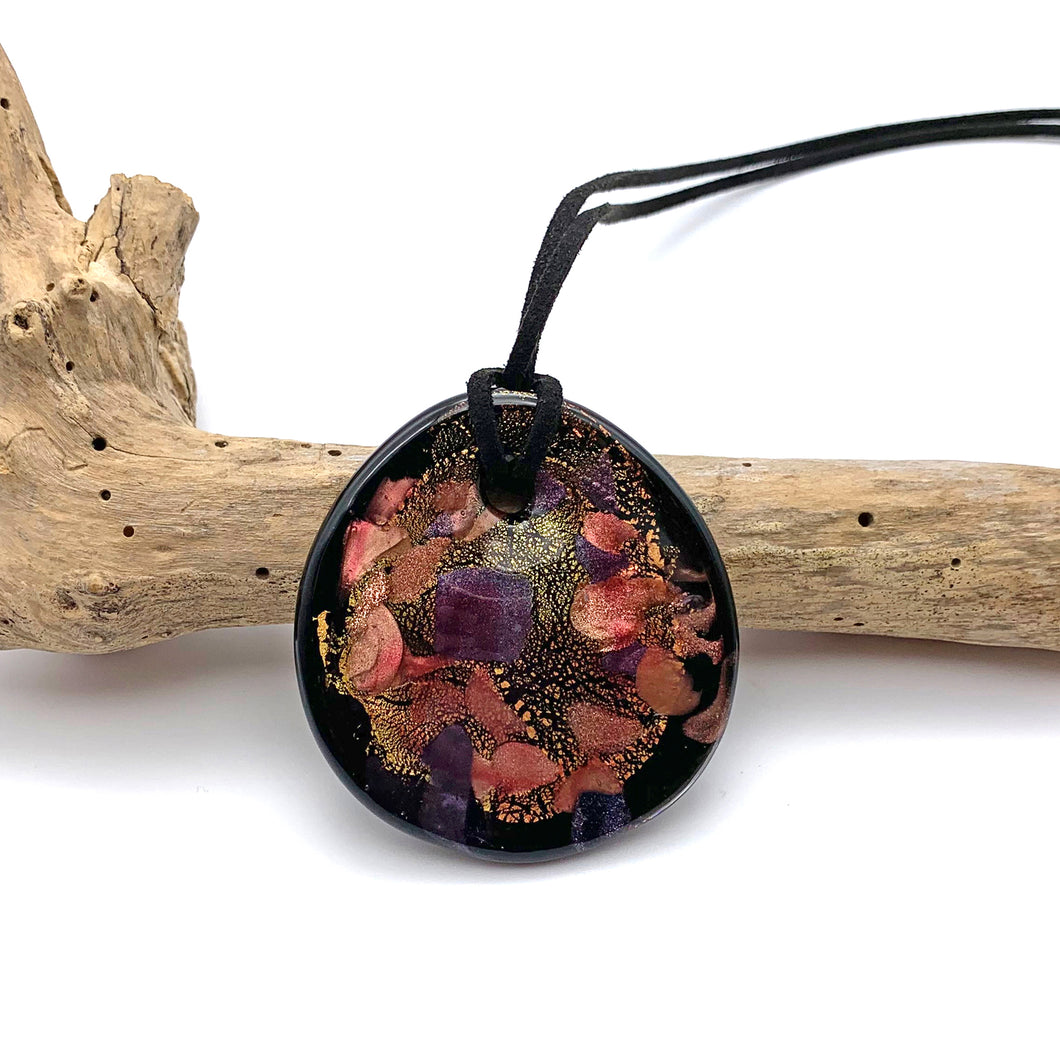 Necklace with shades of pink, purple, gold on black Murano glass circular flat pendant