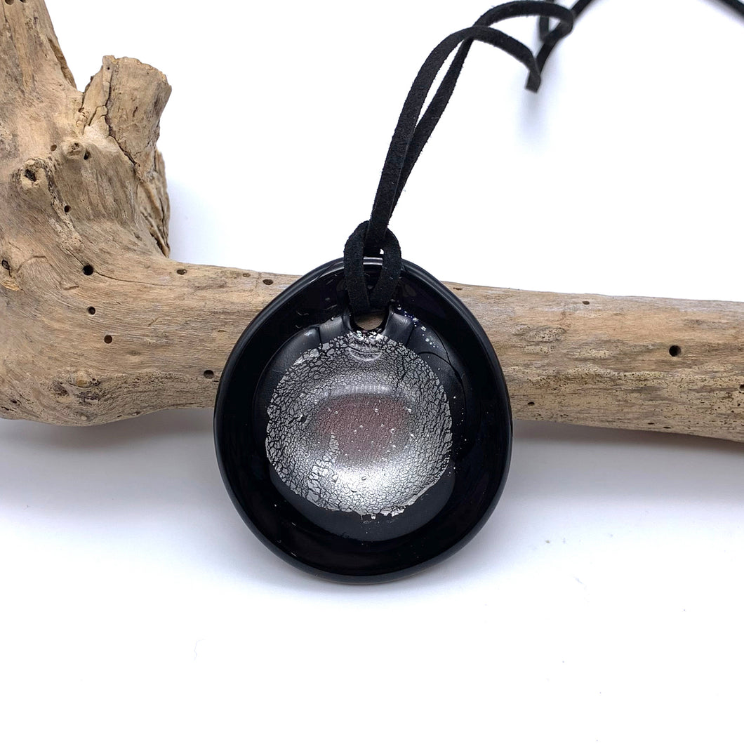 Necklace with clear crystal and silver on black Murano glass near circular large dome pendant