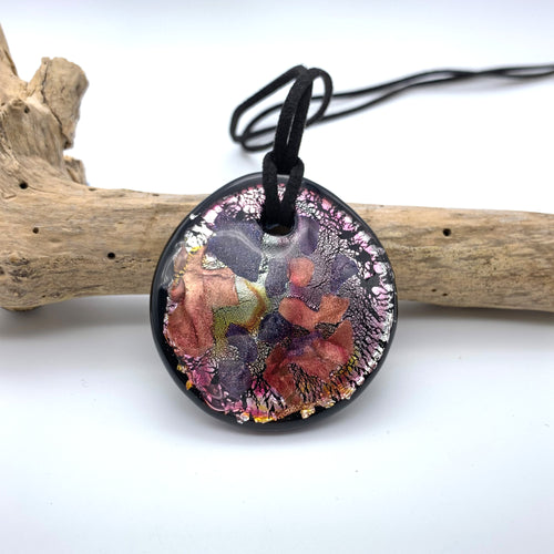 Necklace with shades of pink, purple, silver on black Murano glass circular flat pendant