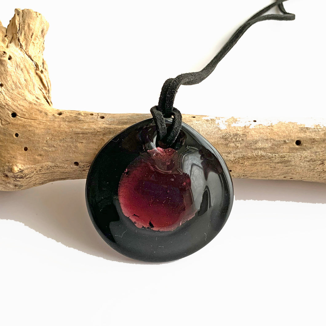 Necklace with dark amethyst and silver on black Murano glass near circular dome pendant