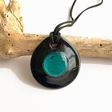 Necklace with teal (green, jade) and silver on black Murano glass near circular dome pendant