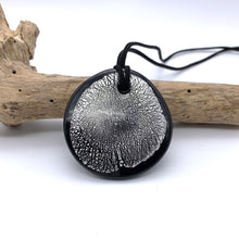 Necklace with clear crystal and silver on black Murano glass near circular large flat pendant