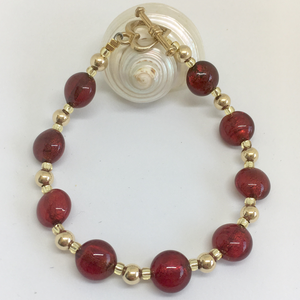 Bracelet with red Murano glass mini lentil beads on gold beads and clasp