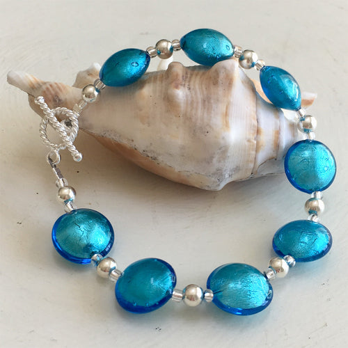 Bracelet with turquoise (blue) Murano glass small lentil beads on silver beads and clasp