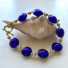 Bracelet with dark blue (cobalt) Murano glass small lentil beads on gold beads and clasp