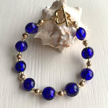 Bracelet with dark blue (cobalt) Murano glass mini lentil beads on gold beads and clasp