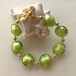 Bracelet with light green (lime, peridot) Murano glass medium lentil beads on gold