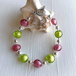 Bracelet with rose pink (cerise) and light green (peridot) Murano glass mini lentil beads on silver
