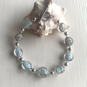 Bracelet with light (pale) blue and aventurine Murano glass mini lentil beads on silver