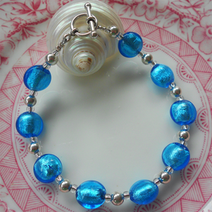 Bracelet with turquoise (blue) Murano glass mini lentil beads on silver beads and clasp