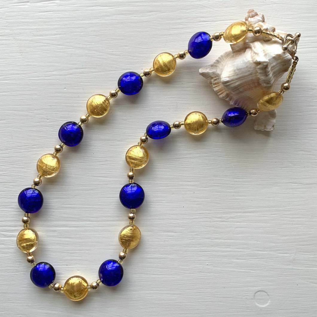 Necklace with light gold and dark blue (cobalt) Murano glass small lentil beads on gold