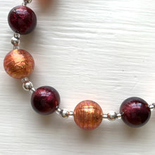 Necklace with burnt orange and dark amethyst Murano glass small sphere beads on silver