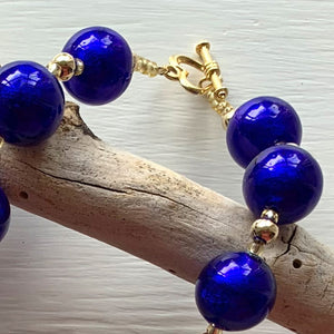 Necklace with dark blue (cobalt) Murano glass small sphere beads on gold