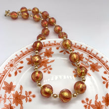 Necklace with ruby red and gold Murano glass sphere beads on gold beads and clasp