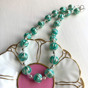Necklace with teal (green, jade) appliqué over white gold Murano glass small sphere beads on silver