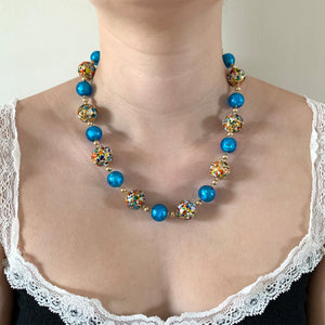 Necklace with speckled colours and turquoise Murano glass sphere beads on gold
