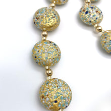 Necklace with speckled blues and white over gold Murano glass lentil beads on gold