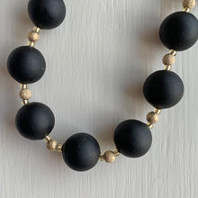 Necklace with matt black Murano glass small sphere beads on gold stardust beads and clasp