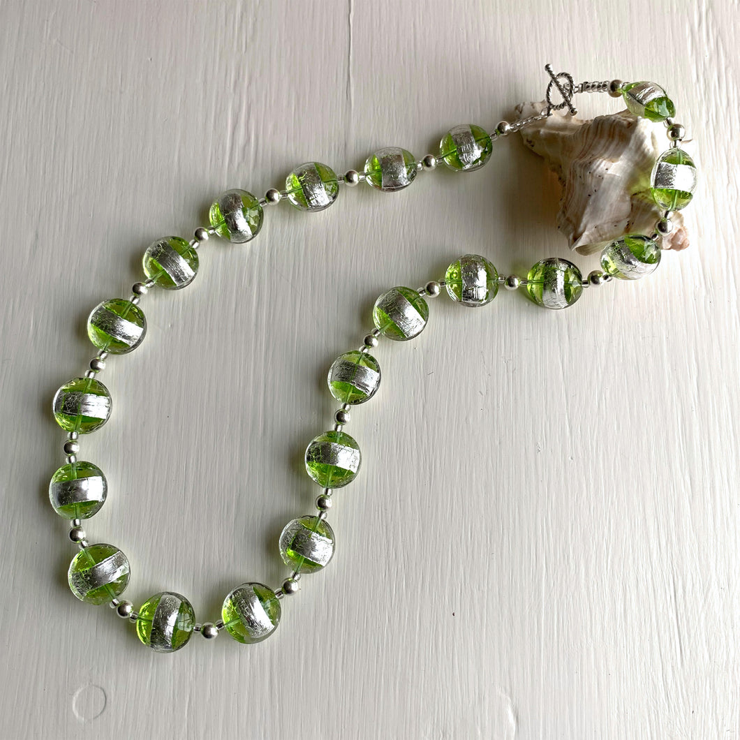 Necklace with green translucent and silver Murano glass medium lentil beads on silver
