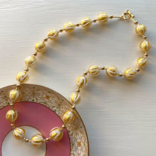 Necklace with white pastel drizzle and gold Murano glass sphere beads on gold
