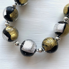 Necklace with black pastel, silver and gold Murano glass sphere beads on silver