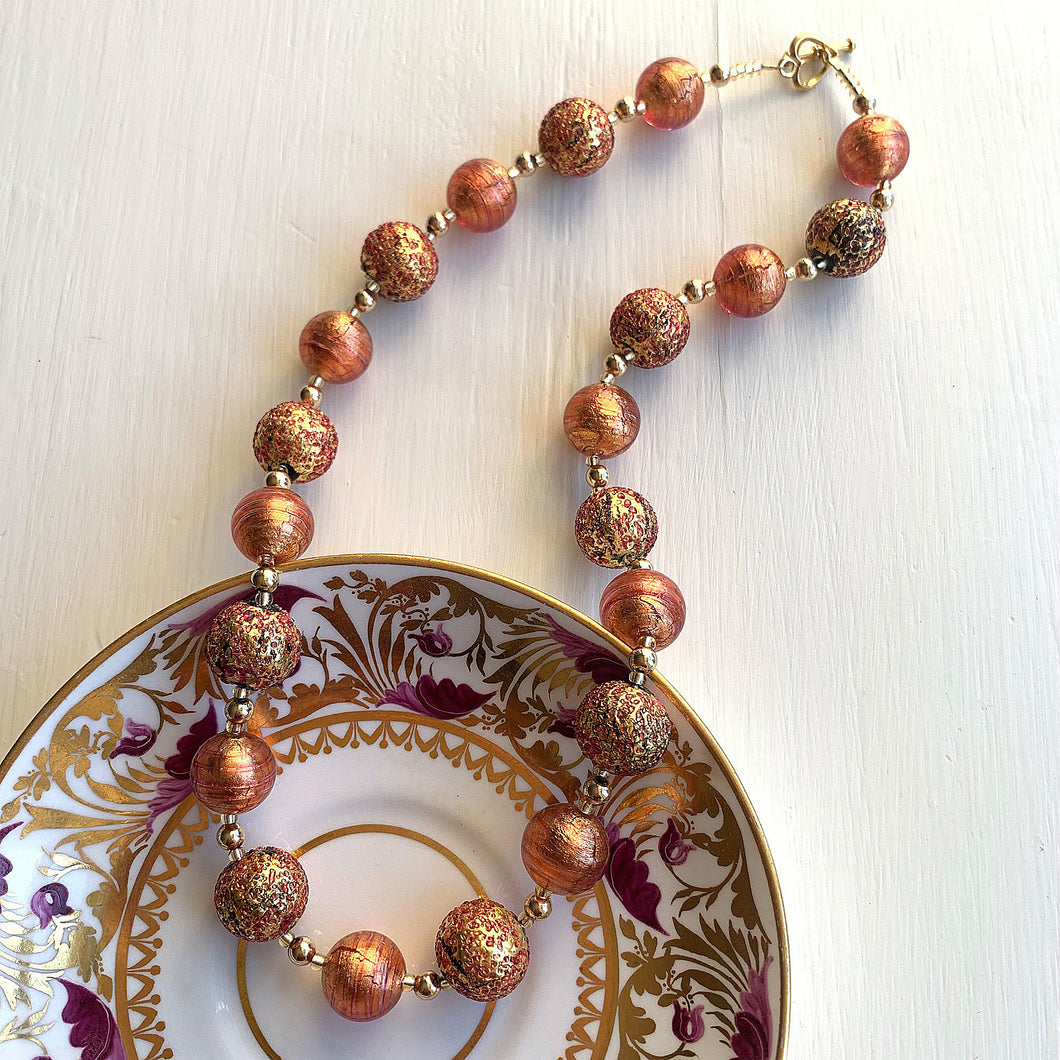 Necklace with speckled burnt orange (rose pink) Murano glass sphere beads on gold