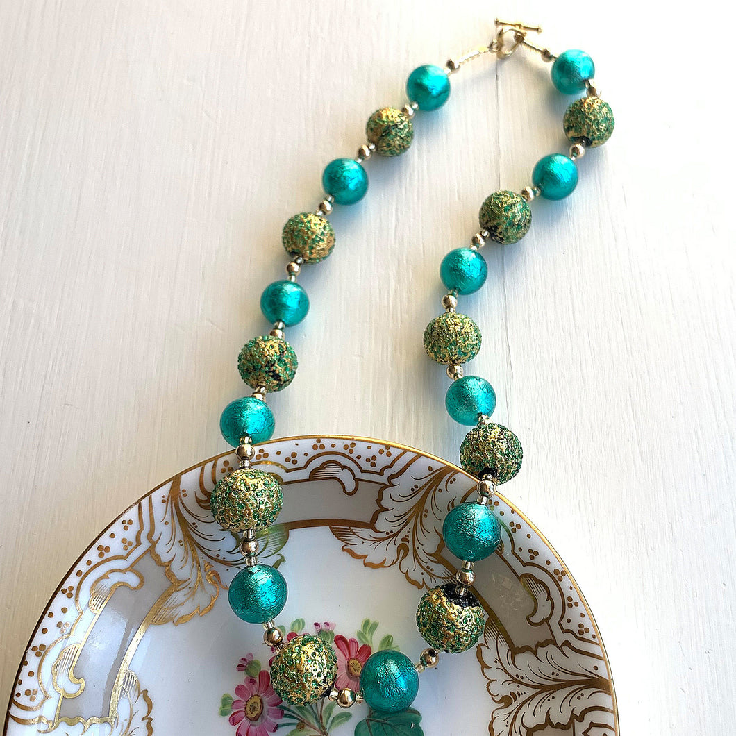 Necklace with speckled teal (green, jade) over gold and teal Murano glass sphere beads on gold
