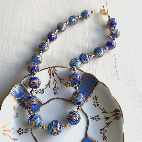 Necklace with light and dark blue swirl, aventurine, gold Murano glass sphere beads on gold