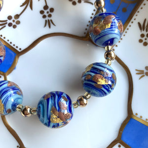 Necklace with light and dark blue swirl, aventurine, gold Murano glass sphere beads on gold