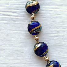 Necklace with dark blue (cobalt) teal gold swirl Murano glass small lentil beads on gold